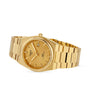 A gold Tissot PRX Powermatic 80 wristwatch with a textured dial, date at 3 oclock, matching gold bracelet, and Nivachron hairspring is displayed on a white background.