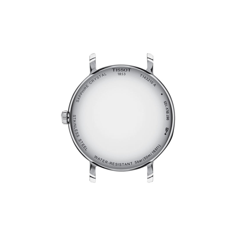 The image displays the back of a Tissot Everytime wristwatch, showcasing its round stainless steel case engraved with details about its features—an iconic example of classic Tissot craftsmanship.