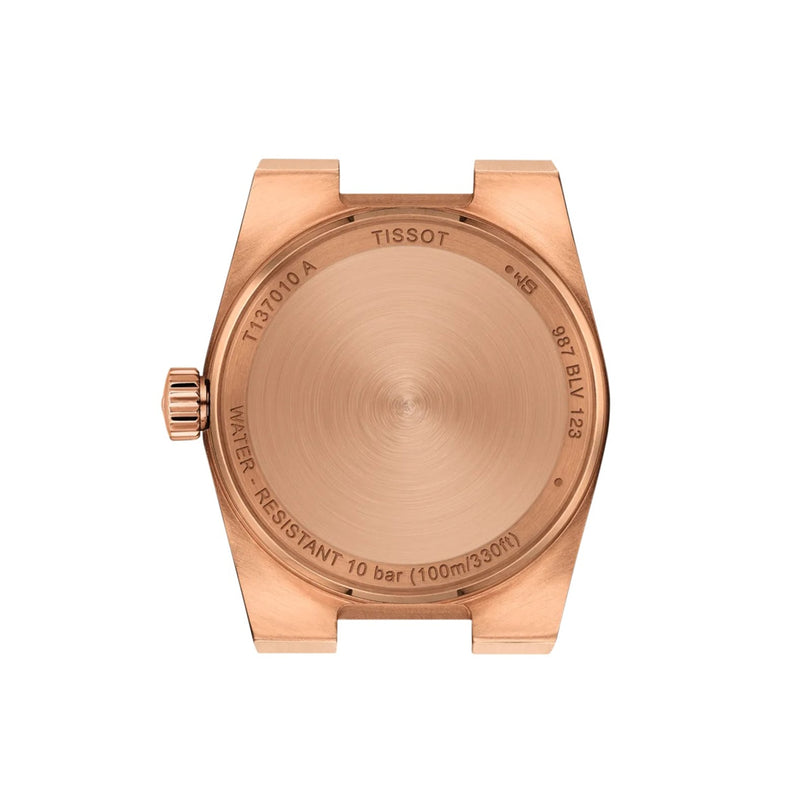 Back view of a rose-gold PVD Tissot PRX watch case, showcasing quartz movement details and engravings of model information, water resistance, and serial numbers.
