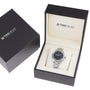 A TAG Heuer Aquaracer with a metal band is showcased in an open branded box featuring a black exterior and cream interior, emphasizing the watchs signature water resistance.