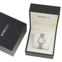 A TAG Heuer Link Date wristwatch with a silver metal band and diamond indexes is displayed in an open black presentation box beside its matching outer box.