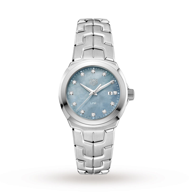 The TAG Heuer Link Date is a refined ladies’ automatic watch featuring a blue mother-of-pearl dial, silver markers, diamond indices, date at 3 o’clock, and a stainless steel bracelet.