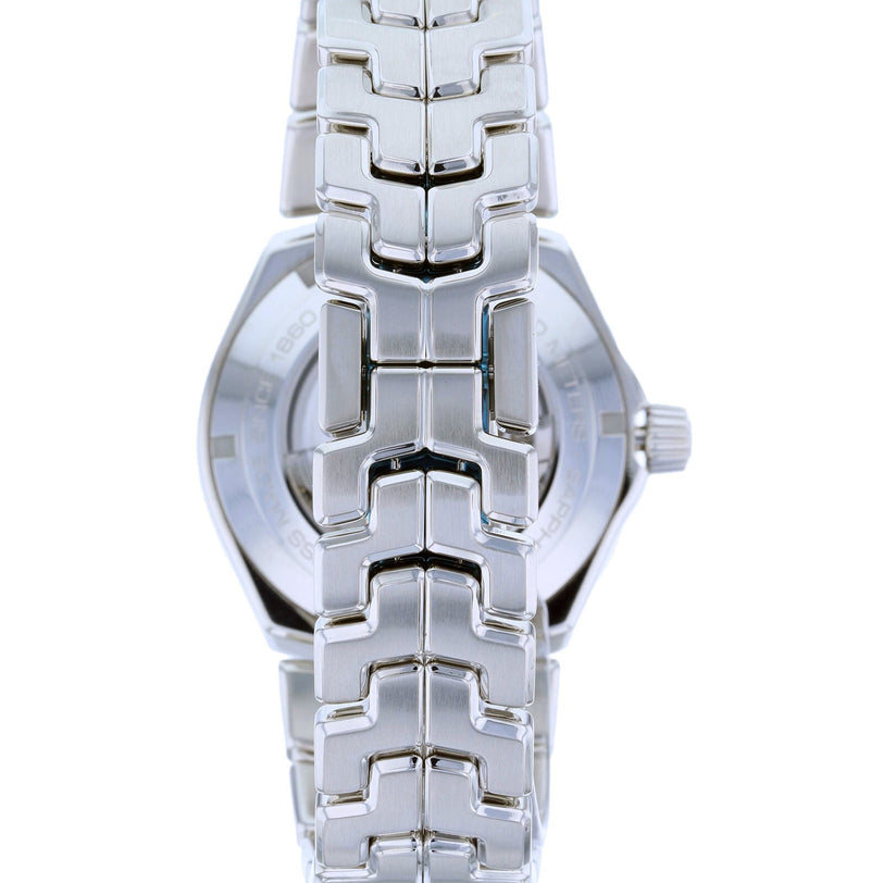 Close-up of the TAG Heuer Link Dates silver metal watchband and case, viewed from the back.