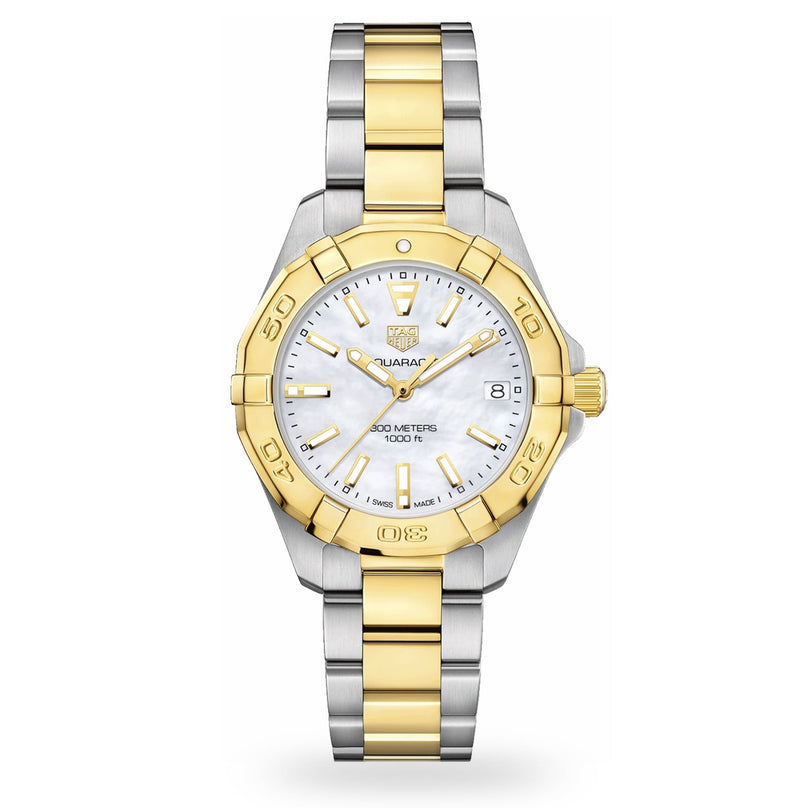 The TAG Heuer Aquaracer Date is a two-tone stainless steel and gold sports watch with a white dial, gold bezel, and date display at 3 o’clock.