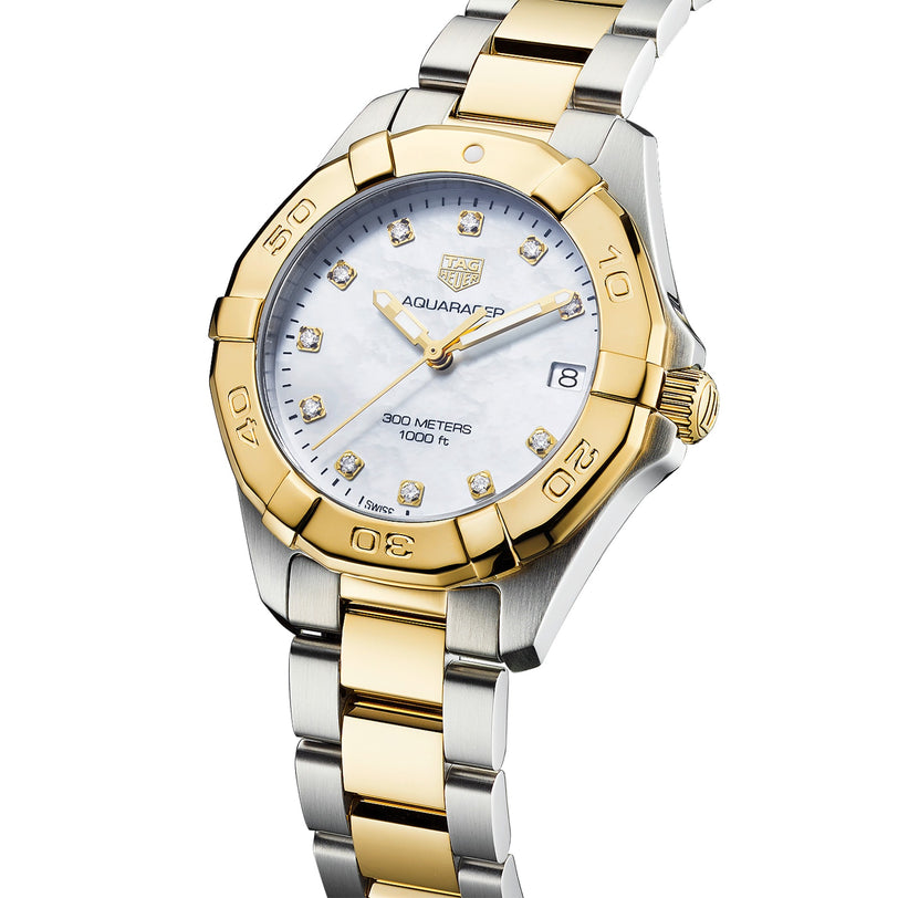 The TAG Heuer Aquaracer Date is a two-tone sports watch with a mother-of-pearl dial, gold bezel, diamond hour markers, date display at 3 o’clock, and a metal bracelet.