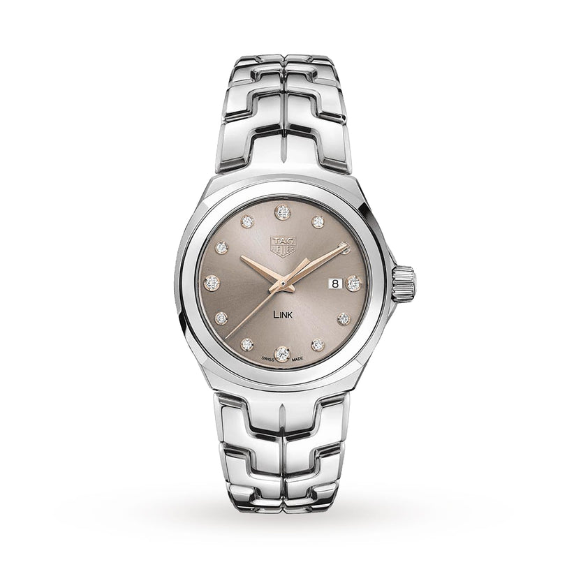 A TAG Heuer Link Date luxury watch in silver, featuring a sunburst taupe dial, diamond hour markers, a date window at 3 o’clock, and the signature S-shaped bracelet, displayed against a white background.