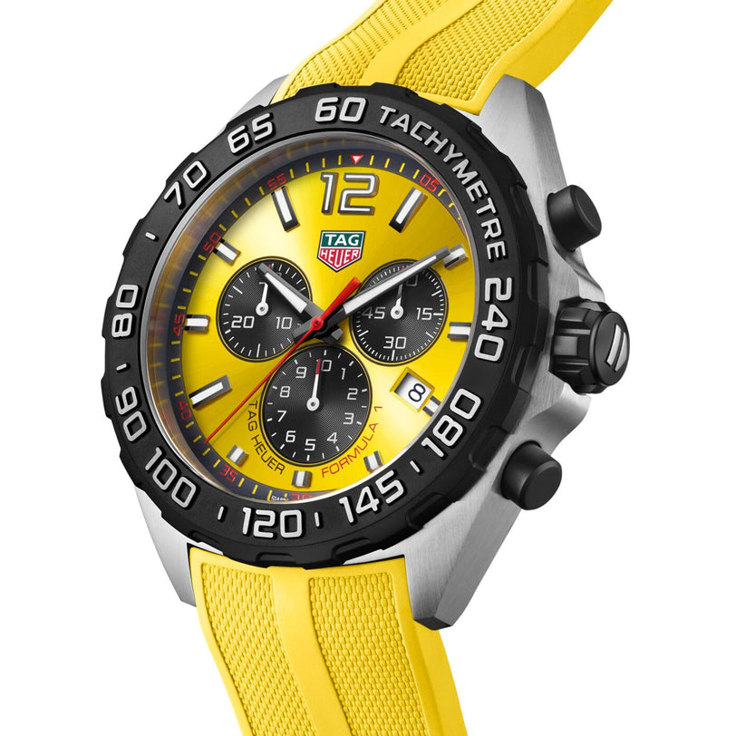 The TAG Heuer Formula 1 Chronograph features quartz movement, a black bezel, three subdials, and a yellow rubber strap.