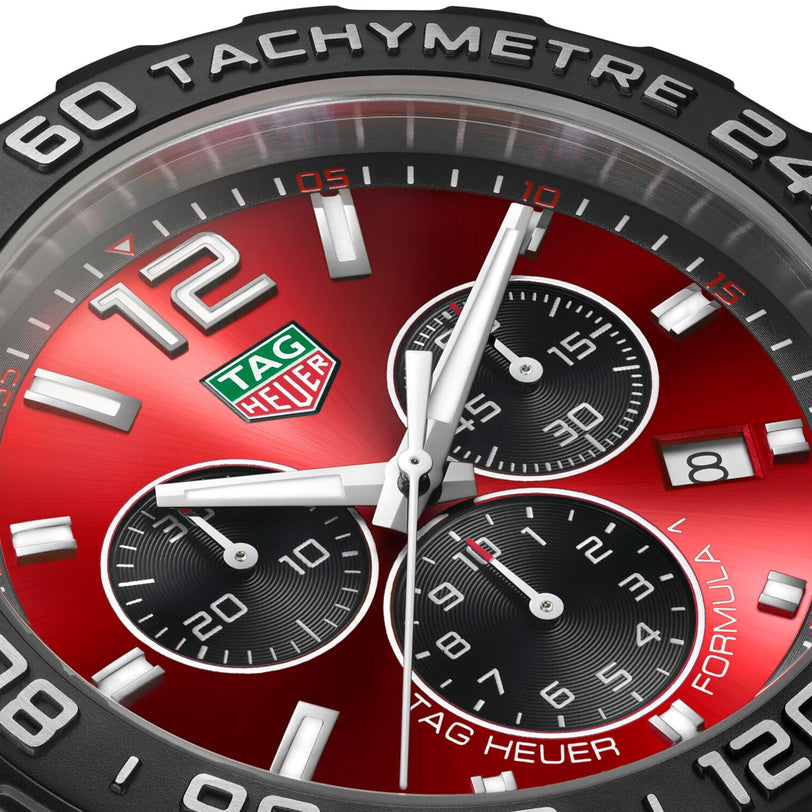 Close-up of the TAG Heuer Formula 1 Chronograph, featuring a red dial, three black subdials, date at 4 o’clock, tachymeter bezel, and a sturdy stainless steel case.