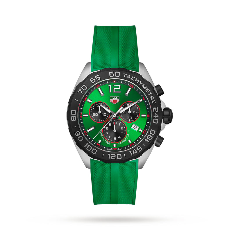 The TAG Heuer Formula 1 Chronograph features quartz movement, a green rubber strap, black tachymeter bezel, and three subdials on a green dial, shown against a white background.