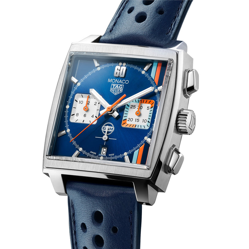 The TAG Heuer Special Edition Monaco Gulf features a blue square dial, two subdials, date window, perforated blue leather strap, and runs on the automatic Heuer 02 movement.