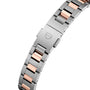 Close-up of the TAG Heuer Carrera Dates two-tone metal bracelet with alternating silver and rose gold links, featuring a clasp engraved with the TAG Heuer shield logo.