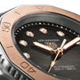 Close-up of the TAG Heuer Aquaracer Professional 200 Date watch featuring diamond indexes, a rose gold bezel, and text showing automatic movement plus water resistance to 200 meters (660 feet).