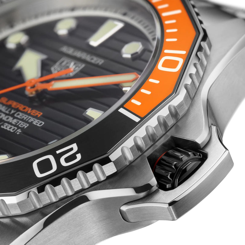 Close-up of the TAG Heuer Aquaracer Professional 1000 Superdiver, showcasing its stainless steel case, orange and black rotating bezel, ridged black dial, and robust crown guard for superior water resistance.