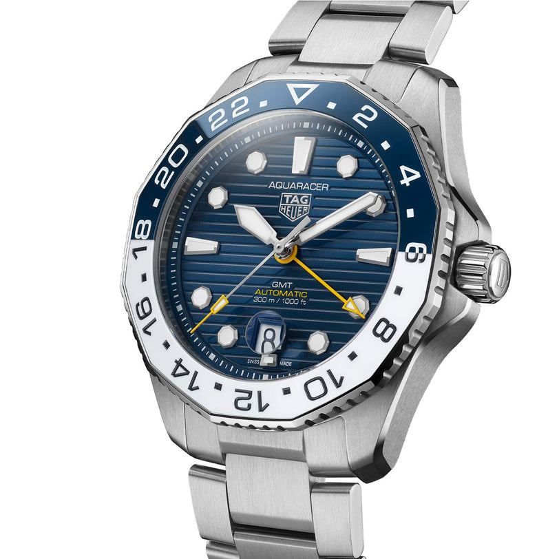 The TAG Heuer Aquaracer Professional 300 GMT features a stainless steel case, blue and white bezel, blue dial, GMT movement, date window at 6 o’clock, and a silver link bracelet.