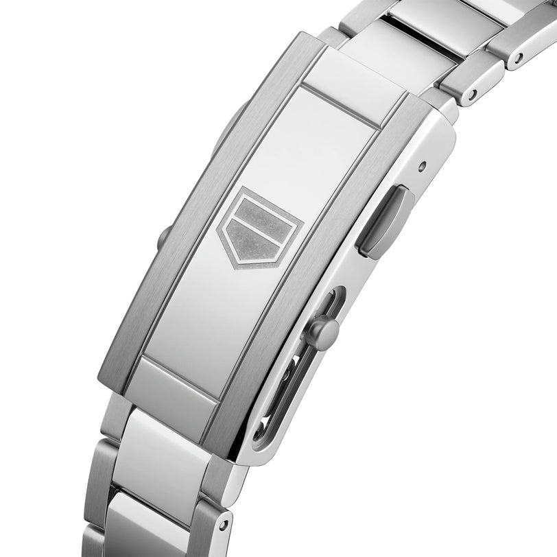 Close-up of TAG Heuer Aquaracer Professional 300 Dates stainless steel bracelet, showing a rectangular clasp with an engraved geometric logo and an adjustment mechanism on the side.