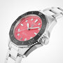 The TAG Heuer Aquaracer Professional 300 Date is a silver dive watch with a stainless steel case, black bezel, and pink dial featuring diamond hour markers.