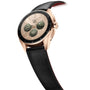 A TAG Heuer Connected Calibre E4 Golden Bright Edition luxury watch with a black leather strap and digital display is shown at an angle on a white background.