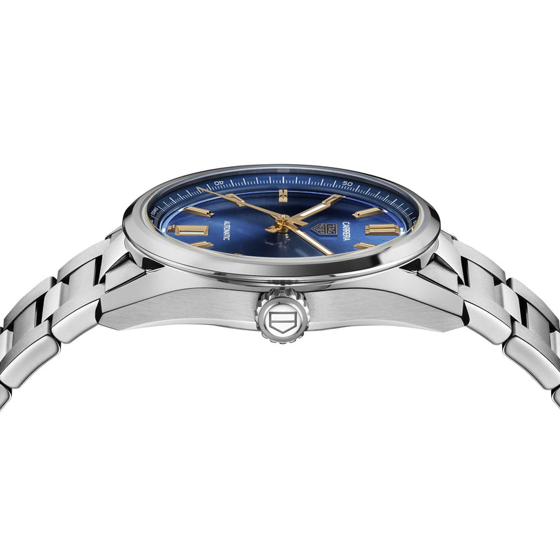 The TAG Heuer Carrera Date is a stainless steel wristwatch with a blue face, gold hour markers and hands, and a silver bracelet, displayed from the side—an ideal fusion of endurance and style.