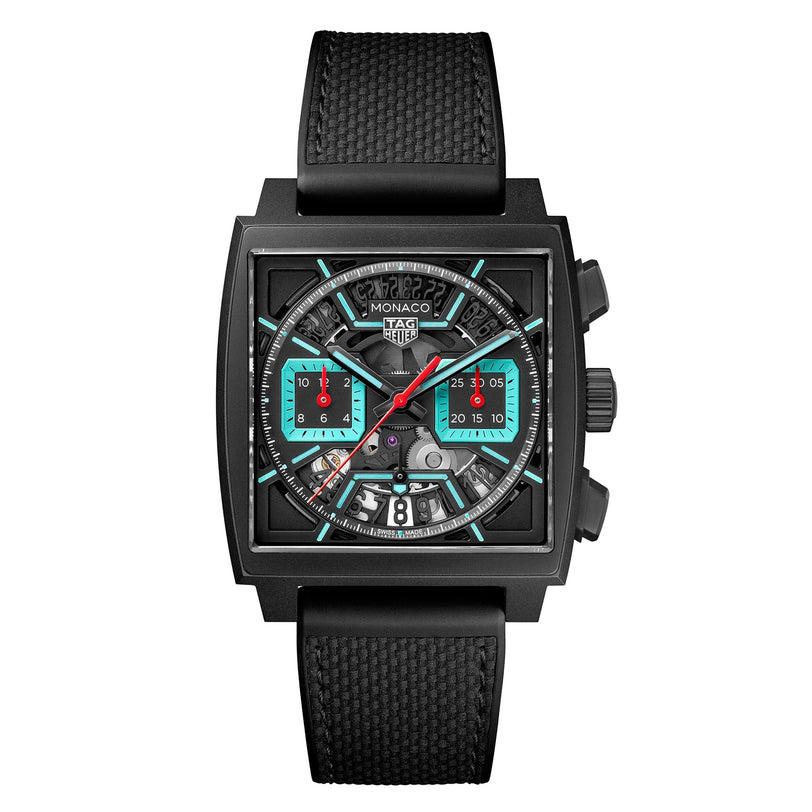 The TAG Heuer Monaco Chronograph is a square black wristwatch with visible gears, turquoise and red accents, and a black textured strap.