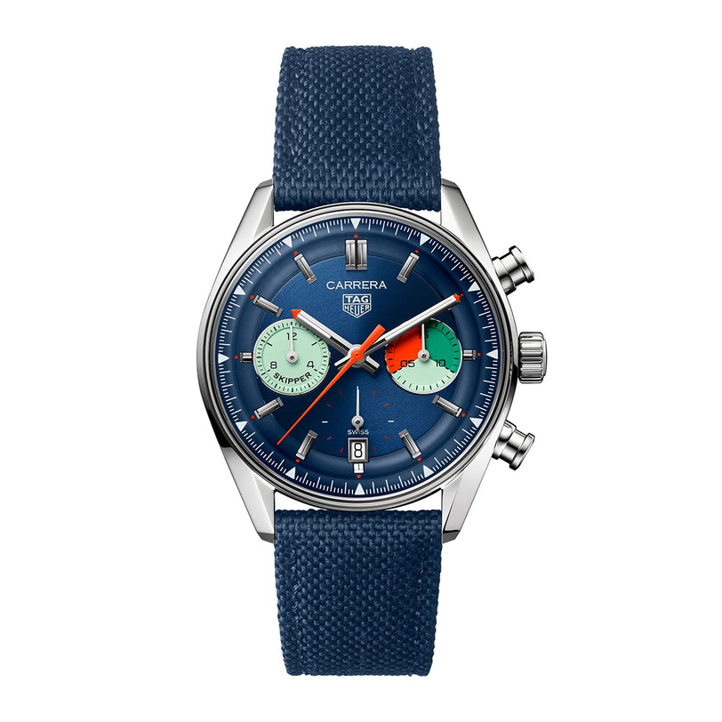 The TAG Heuer Carrera Chronograph Skipper features a blue dial and strap, two green subdials, a silver case, TH20-06 calibre movement, and a date display at 6 o’clock—taking inspiration from the Carrera Panamericana race.