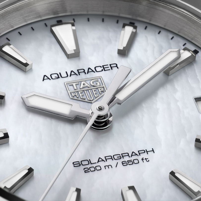 Close-up of the TAG Heuer Aquaracer 200 Professional Solargraph watch face, highlighting the brand logo, innovative Solargraph module, and 200m/660ft water resistance in this advanced solar-powered timepiece.