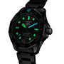 The TAG Heuer Aquaracer Professional 300 Date is a black wristwatch with glowing green and blue markers on a dark dial and a sleek black metal bracelet, making it a standout among luxury timepieces.