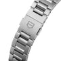 Close-up of a TAG Heuer Carrera Chronograph stainless steel bracelet with folding clasp, engraved shield logo, and durable sapphire crystal.