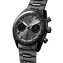The TAG Heuer Carrera Chronograph features a stainless steel band, grey dial with two black subdials, red chronograph accents, and a sapphire crystal safeguarding its automatic movement.