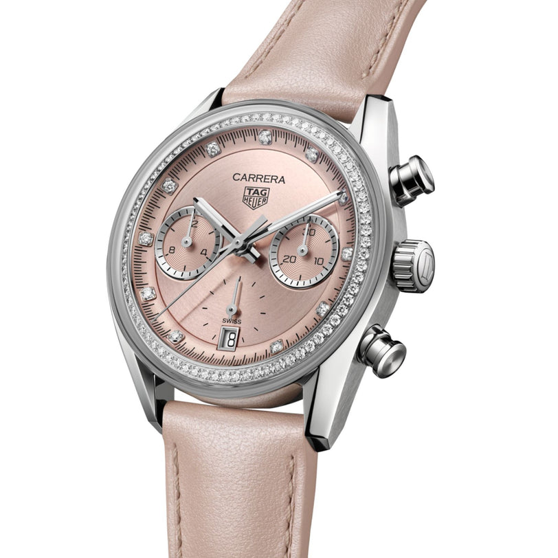 The TAG Heuer Carrera Chronograph features a pink dial, diamond bezel, and a matching pink leather strap.