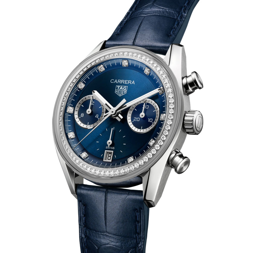 The TAG Heuer Carrera Chronograph features a blue dial, diamond bezel, blue leather strap, and chronograph functions.
