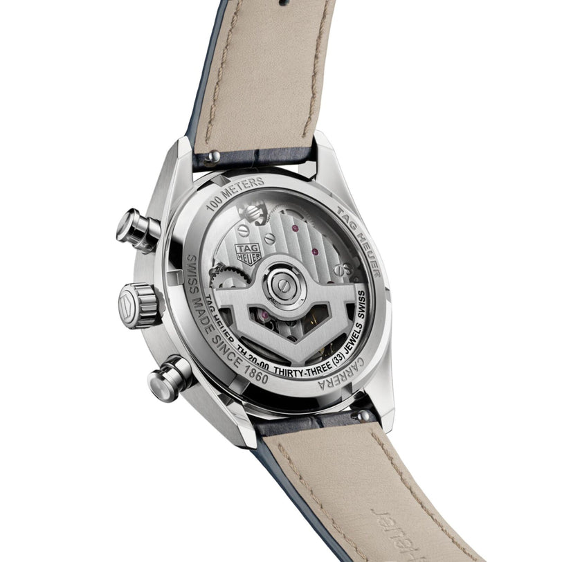 Close-up of the TAG Heuer Carrera Chronographs transparent case back, revealing its intricate mechanical movement and leather strap.