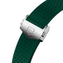 Close-up of a green perforated rubber strap with a brushed metal clasp engraved with TAG Heuer’s shield logo, highlighting the contemporary design technology of the luxury Connected Calibre E4 watch.