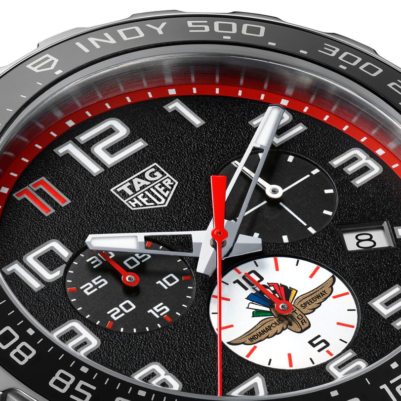 Close-up of the TAG Heuer Special Edition Formula 1 X Indy 500 watch face featuring a quartz chronograph movement, three subdials, date window, and Indianapolis Speedway logo with striking red, white, and black Indy 500 accents.