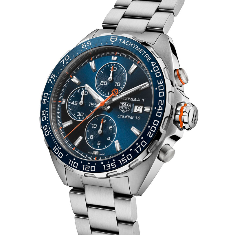 The TAG Heuer Formula 1 Chronograph features a stainless steel case, blue dial with three subdials, date display, and a blue ceramic tachymeter bezel.