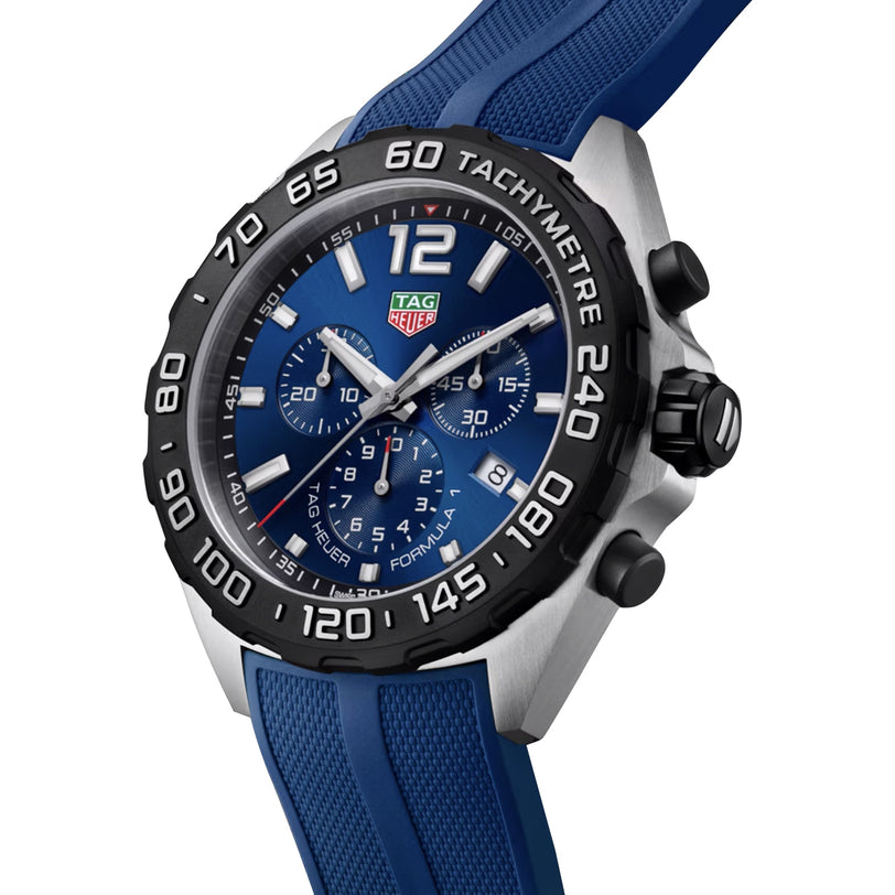 The TAG Heuer Formula 1 Chronograph boasts a blue dial, silver hour markers, a blue rubber strap, and a black tachymeter bezel—ideal for fans of striking chronograph style.