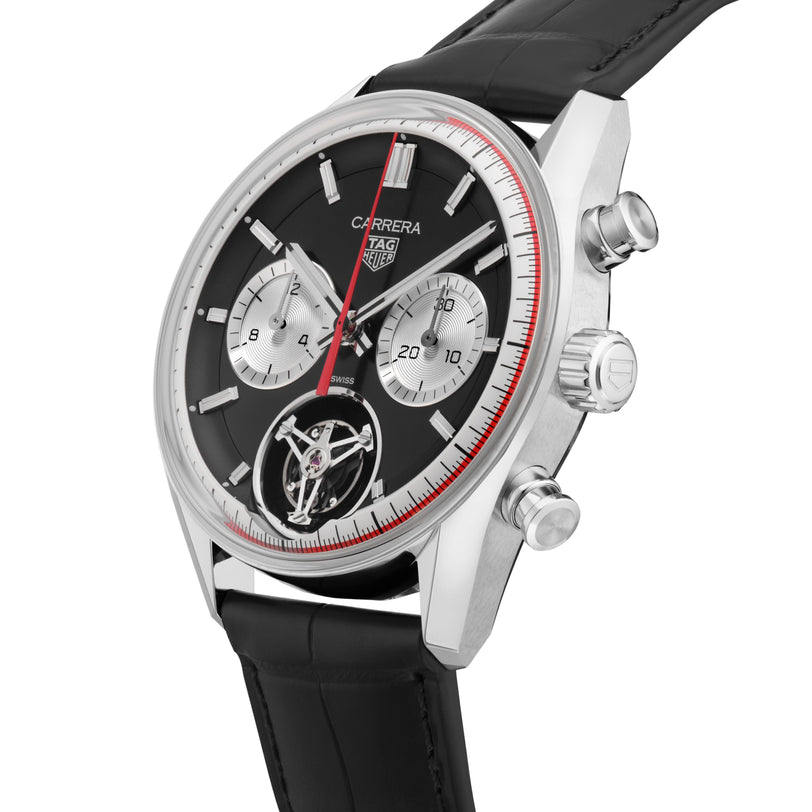 The TAG Heuer Carrera Tourbillon Centenary The Watches of Switzerland Group Exclusive features a black dial, silver subdials, black leather strap, and stainless steel case.