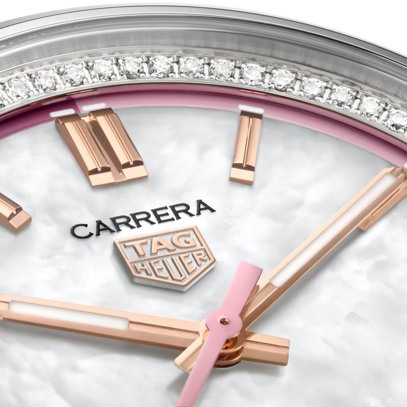 Close-up of the TAG Heuer Carrera Calibre 7 watch face featuring rose gold-plated indexes, a shimmering mother-of-pearl dial, and a diamond-set bezel.