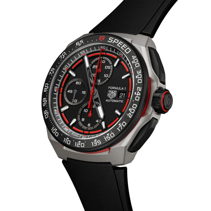 The TAG Heuer Formula 1 Chronograph is a black and silver watch with a black rubber strap, red accents, tachymeter bezel, and a date display at 3 o’clock—reflecting motorsport heritage.
