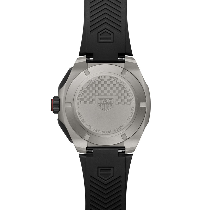 The stainless steel caseback of the TAG Heuer Formula 1 Chronograph features engraved details and a checkered pattern, reflecting its motorsport heritage. The watch comes with a black rubber strap.