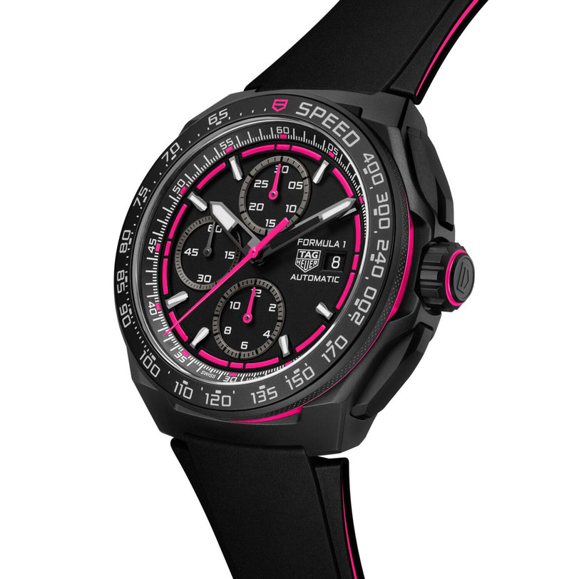 The TAG Heuer Formula 1 Chronograph Limited Edition is a striking black motorsports watch with pink accents, three sub-dials, a black tachymeter bezel, and a sleek black silicone strap trimmed in pink.