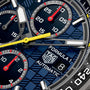 Close-up of a TAG Heuer Formula 1 Chronograph X Oracle Red Bull Racing watch face featuring three subdials and a date window.