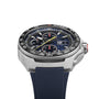 The TAG Heuer Formula 1 Chronograph X Oracle Red Bull Racing features a black tachymeter bezel, blue dial with subdials, yellow accents, and a blue rubber strap, showcased at an angle to highlight the side crown.