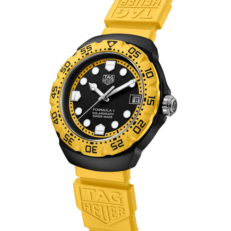 Yellow TAG Heuer Formula 1 Solargraph wristwatch featuring a black bezel and dial, white markers, and a yellow rubber strap.