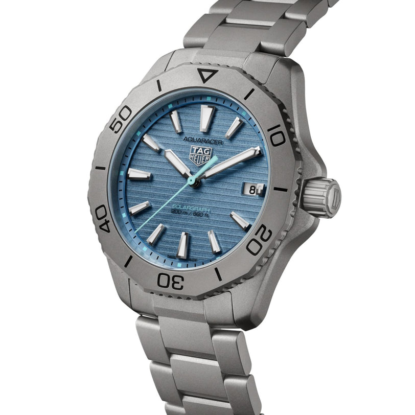 The TAG Heuer Aquaracer Professional 200 Solargraph features a silver stainless steel bracelet and a blue textured dial.