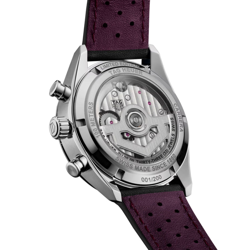 Back view of a TAG Heuer Carrera Chronograph Tourbillon Limited Edition watch, revealing its exposed movement and engraved details, paired with a purple leather strap.