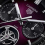 Close-up of a TAG Heuer Carrera Chronograph Tourbillon Limited Edition watch face with a purple background, showing its subdials and hands.