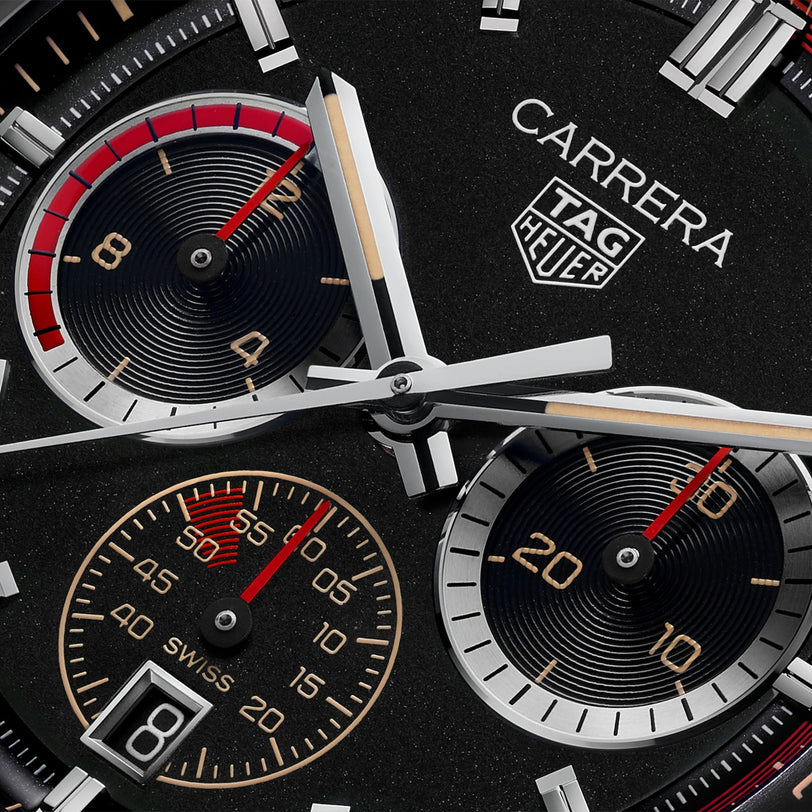Close-up of a TAG Heuer Carrera Chronosprint x Porsche Rallye Limited Edition watch face featuring three subdials and silver hands.