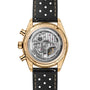 Back view of the TAG Heuer Carrera Chronosprint x Porsche Rallye watch, featuring a gold case, exposed mechanical movement, and black perforated strap.
