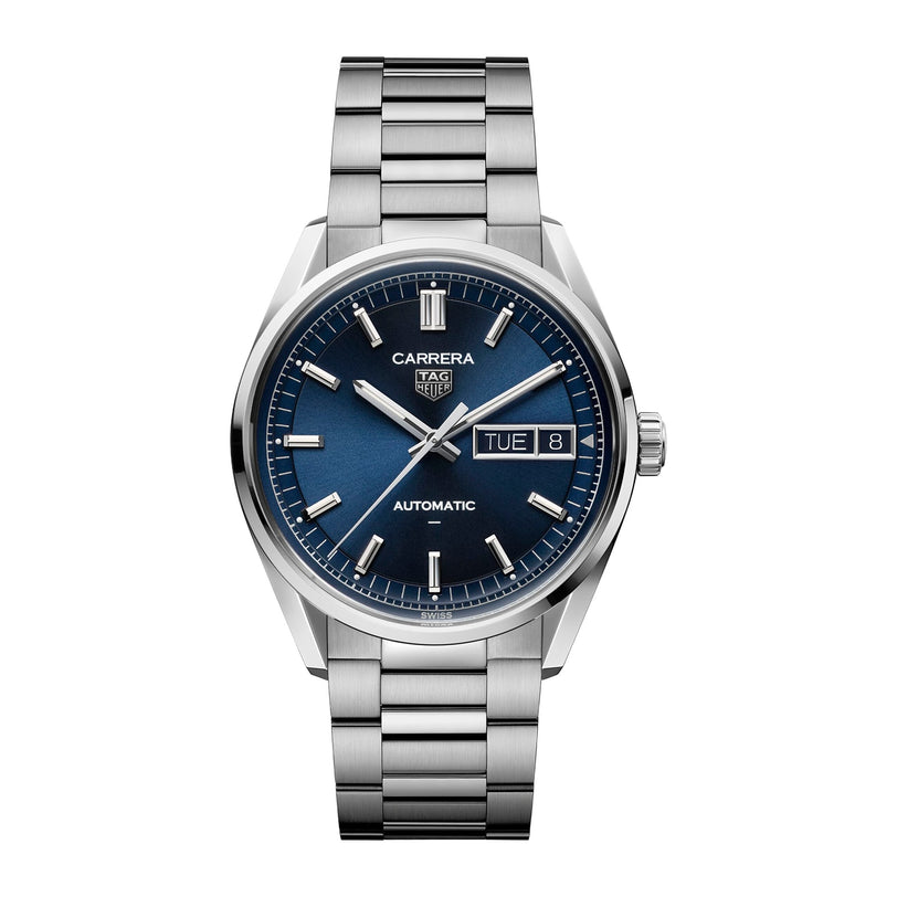 The TAG Heuer Carrera Day-Date features a silver case, blue dial, metal bracelet, and a day-date display at 3 o’clock.