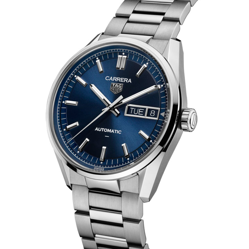 The TAG Heuer Carrera Day-Date watch features a blue dial, day and date display, and a stainless steel bracelet.